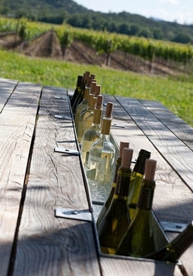 A cool idea for using downspout gutters. A wine stash ! Wine cooler idea for a picnic table